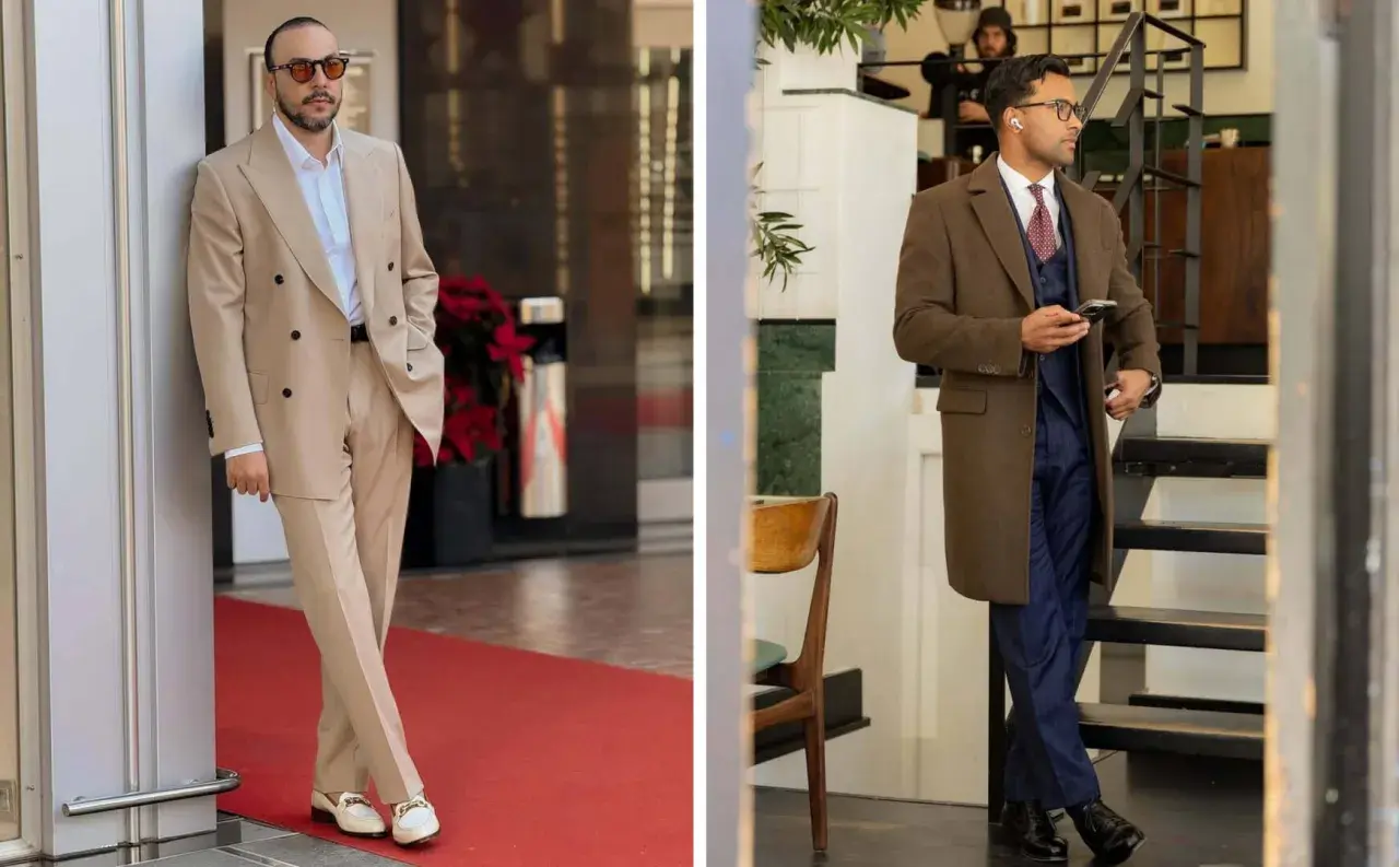 Zwei Männer in eleganten Anzügen. Der linke trägt einen beigen Anzug, der rechte einen dunkelblauen mit braunem Mantel. So muss eine Anzughose sitzen: gerade und ohne Falten.